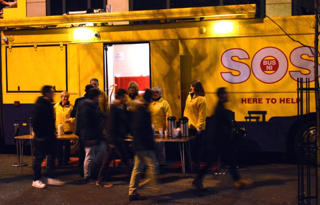 SOS Bus NI operating at night on the street