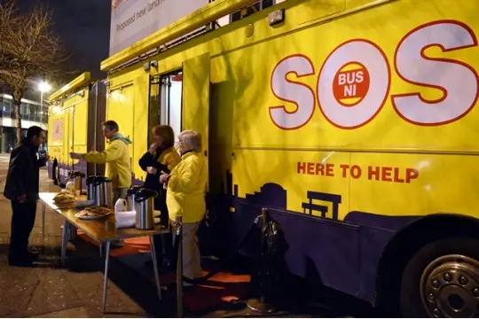 SOS Bus NI night service beside the bus